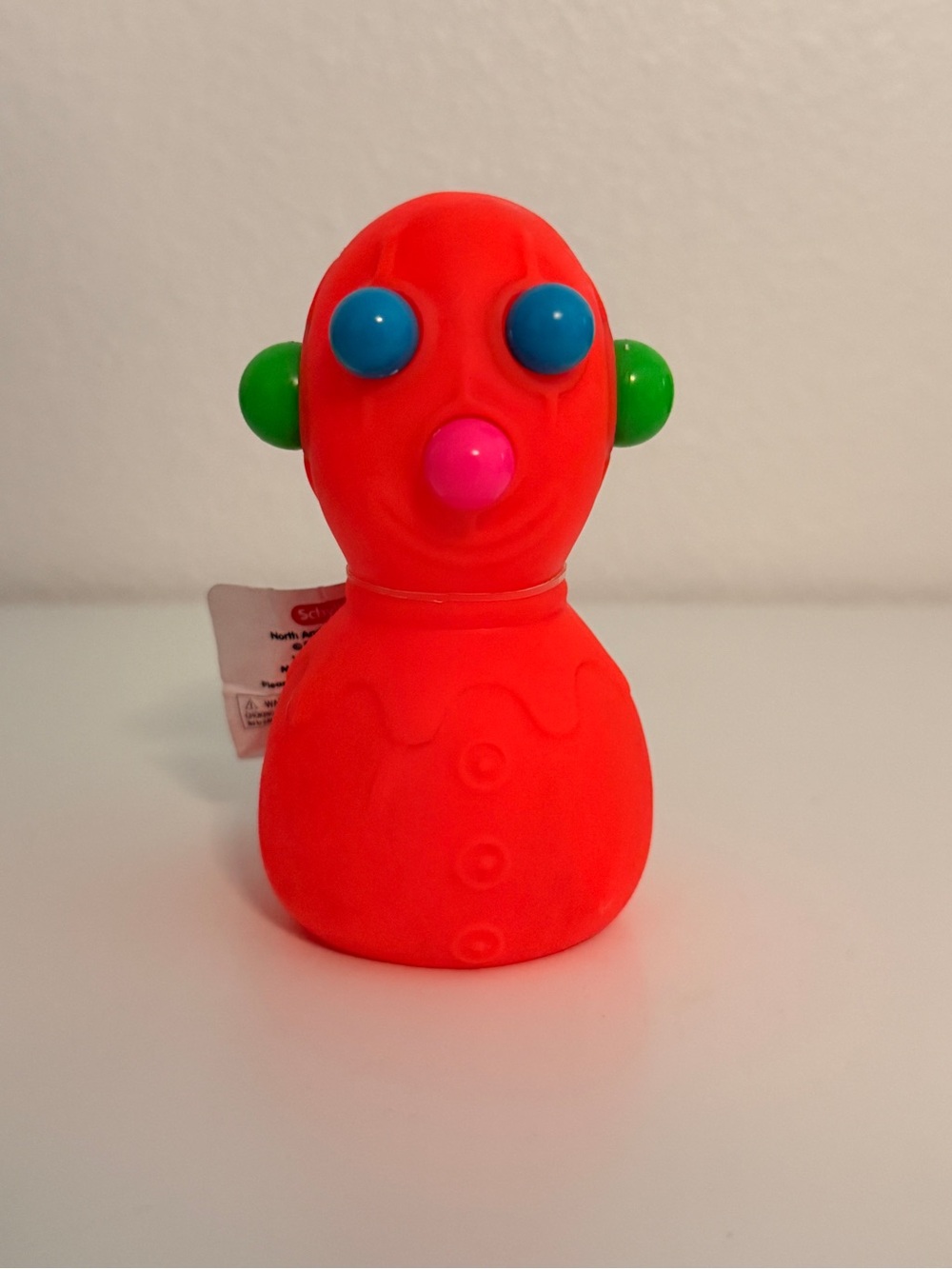 Bright Orange Sensory Toy with Colorful Button Features